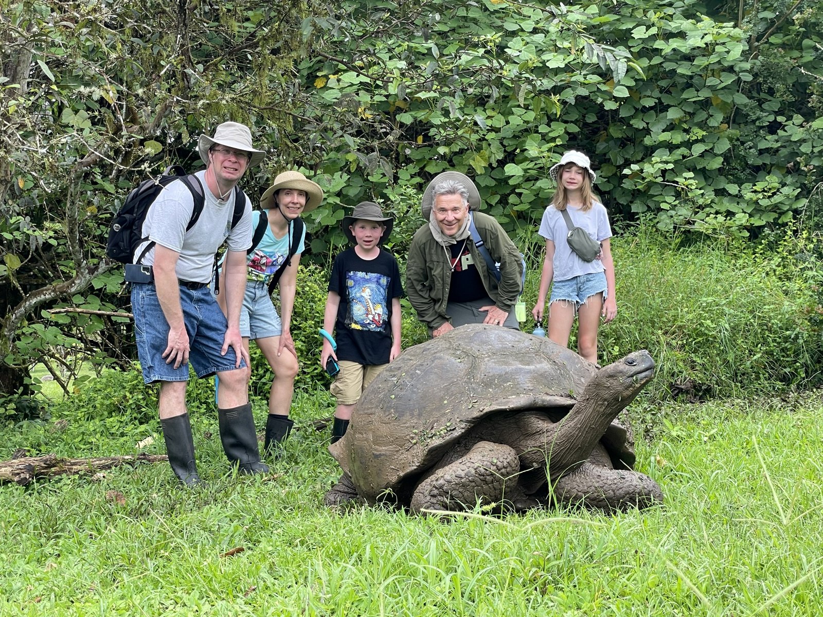 Family group with a giant tortoise