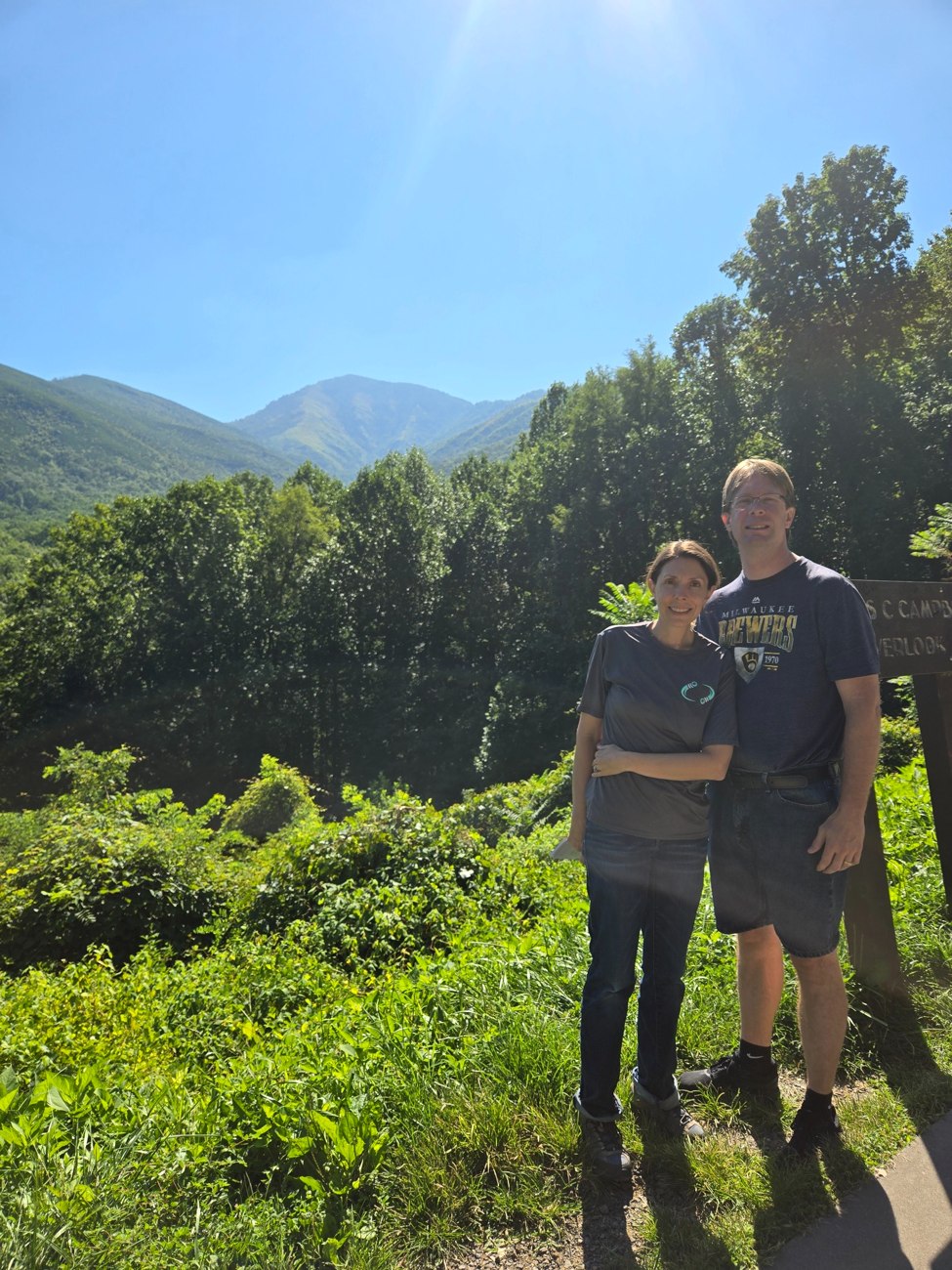 Erik and Michelle overlooking green mountains